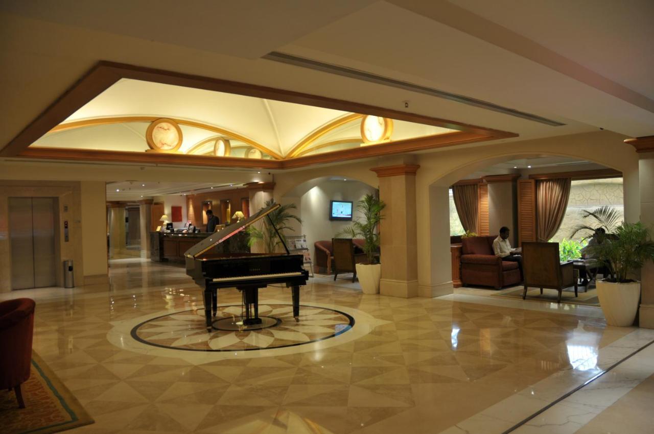 Ramada Plaza By Wyndham Palm Grove Hotel Mumbai Kültér fotó Lobby